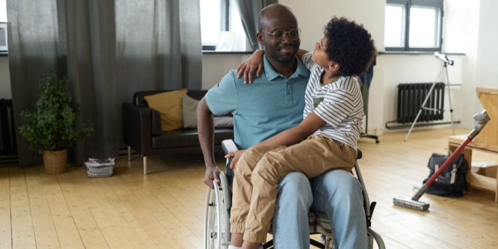 Parent with physical disability enjoying quality time with child under modified custody arrangement