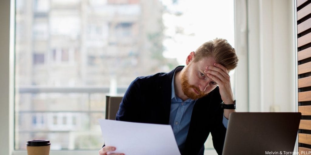 Man discovering financial signs your wife wants a divorce through hidden accounts