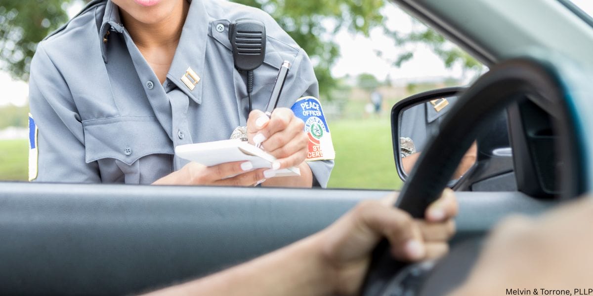 Driver being stopped by police and wondering how traffic tickets dismissed through legal defenses in Washington State